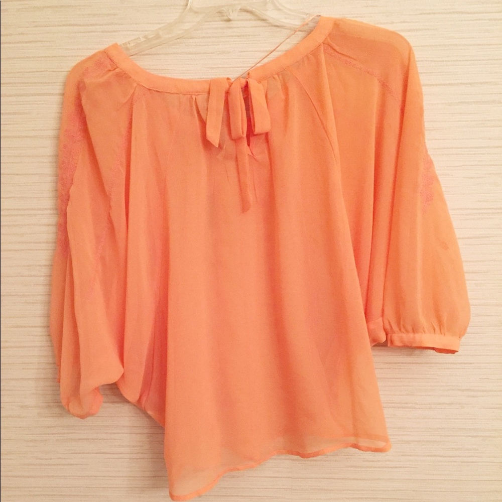 Sheer orange top with embroidery